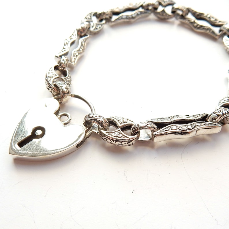 Vintage Sterling Silver Embossed Bracelet with Heart Padlock Catch